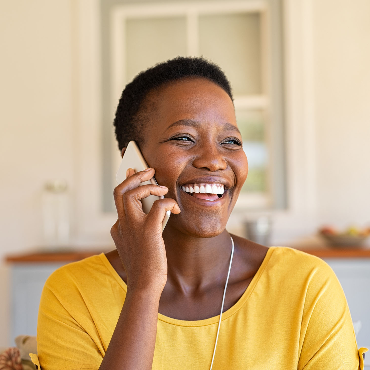 Smiling african american woman talking on the phone